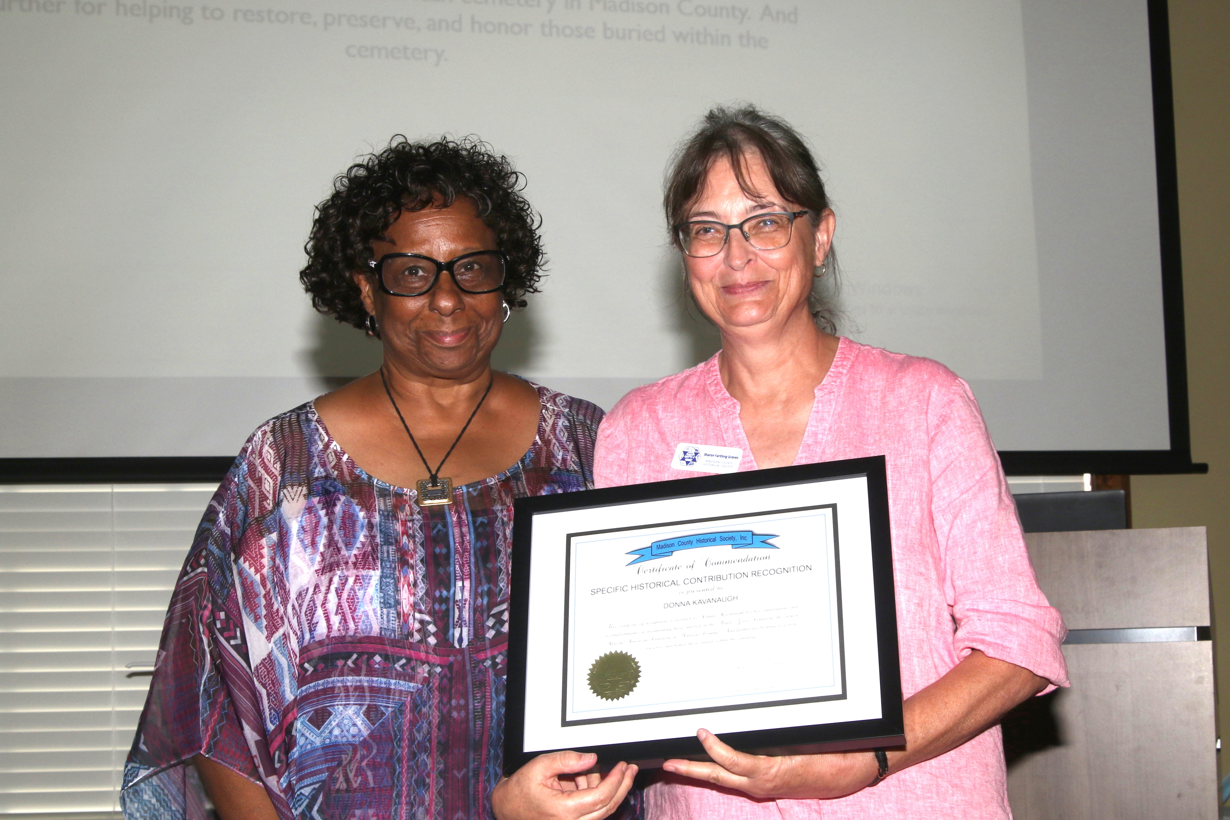 Donna Kavanaugh receiving award from Sharon Graves